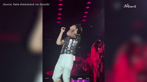 Harry Styles struck by skittles thrown during LA concert