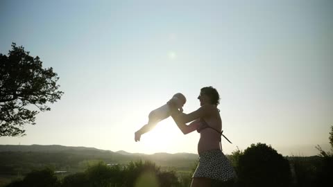 Mother playing with her baby