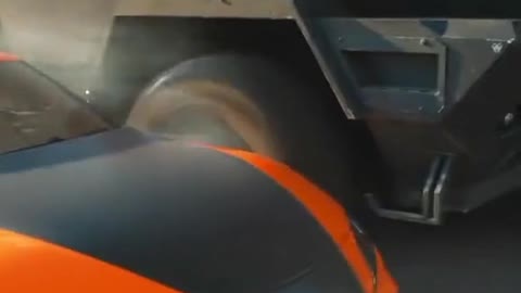 In the movie, the car competes with the big truck, and this scene is too exciting.