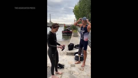 French minister takes plunge into Seine river, less than 2 weeks before start of Paris 2024 Olympics