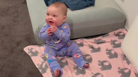 this baby laughed until he rolled over with his puppy