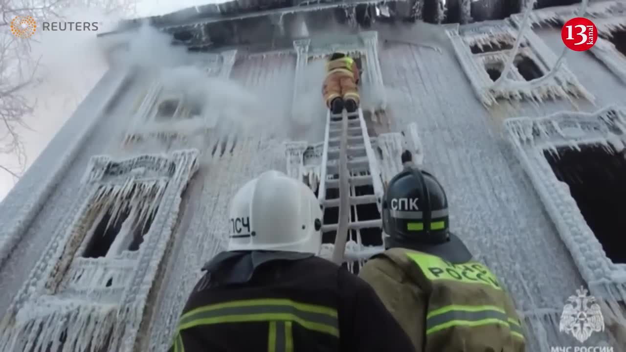 House left encrusted with icicles after Russia firefighters tackle deadly blaze in bitter cold