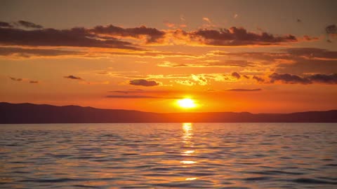 The lake shimmered beautifully at dusk.