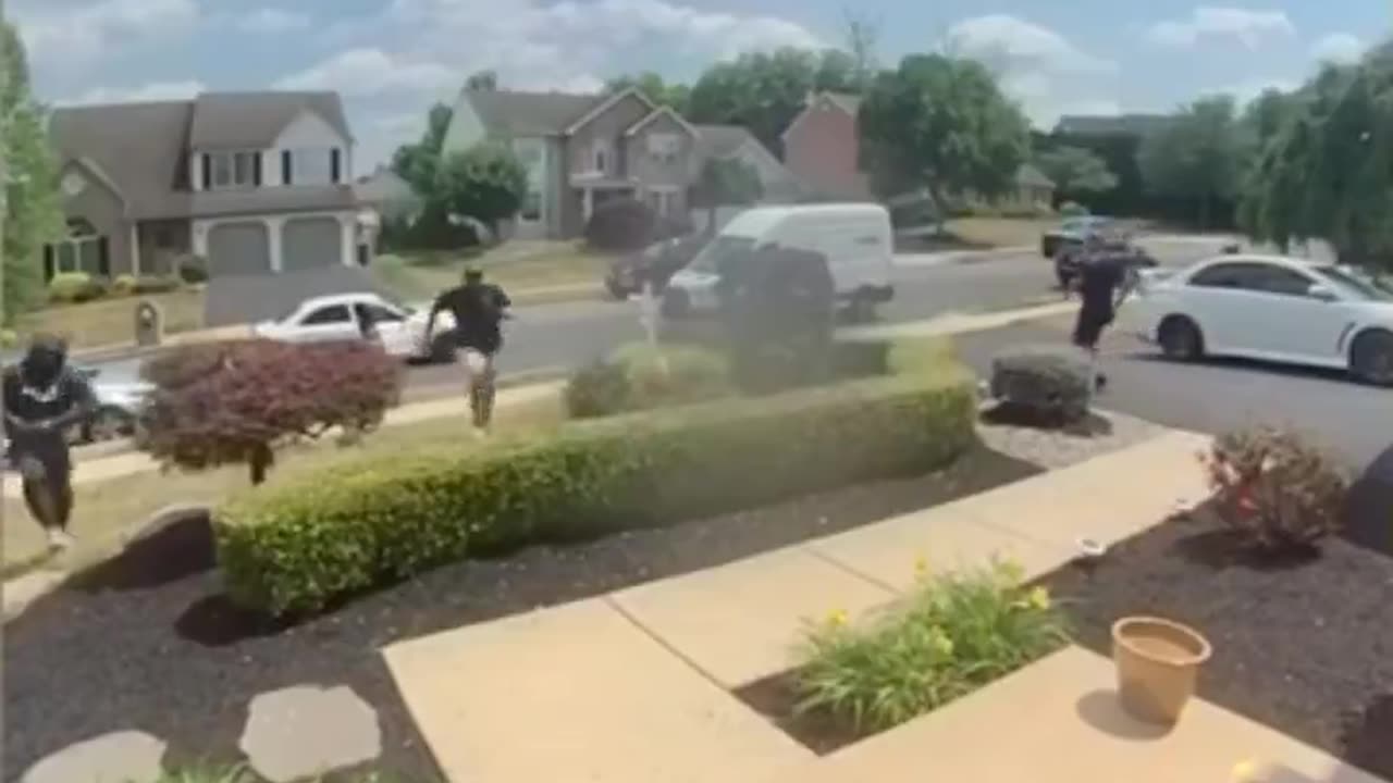 Two in a race to steal a FedEx package fight, seconds after the package was dropped off..