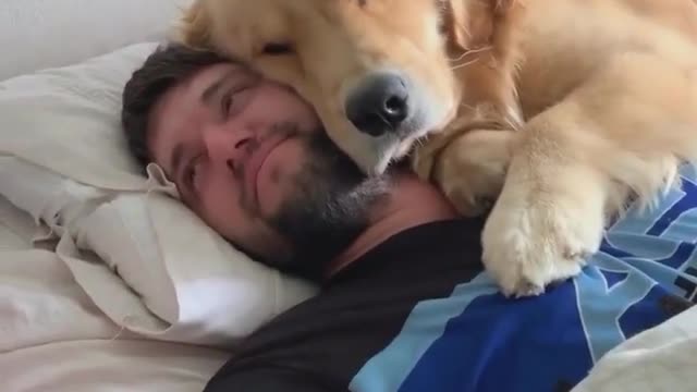 Dog sleeping with daddy.