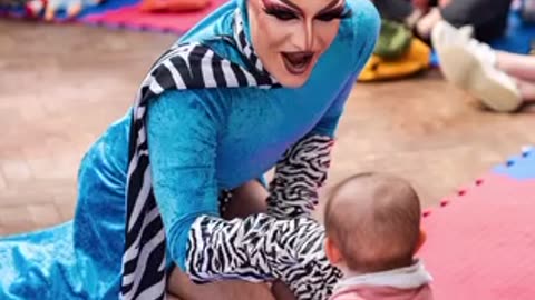 DRAG SHOW FOR BABIES Features Nearly Naked Individuals, Including Men Spreading Legs in Fetish Gear