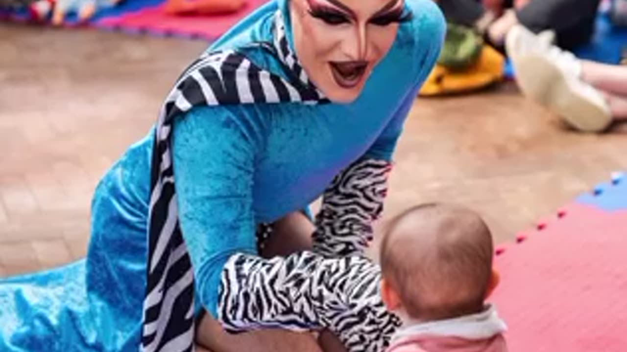 DRAG SHOW FOR BABIES Features Nearly Naked Individuals, Including Men Spreading Legs in Fetish Gear