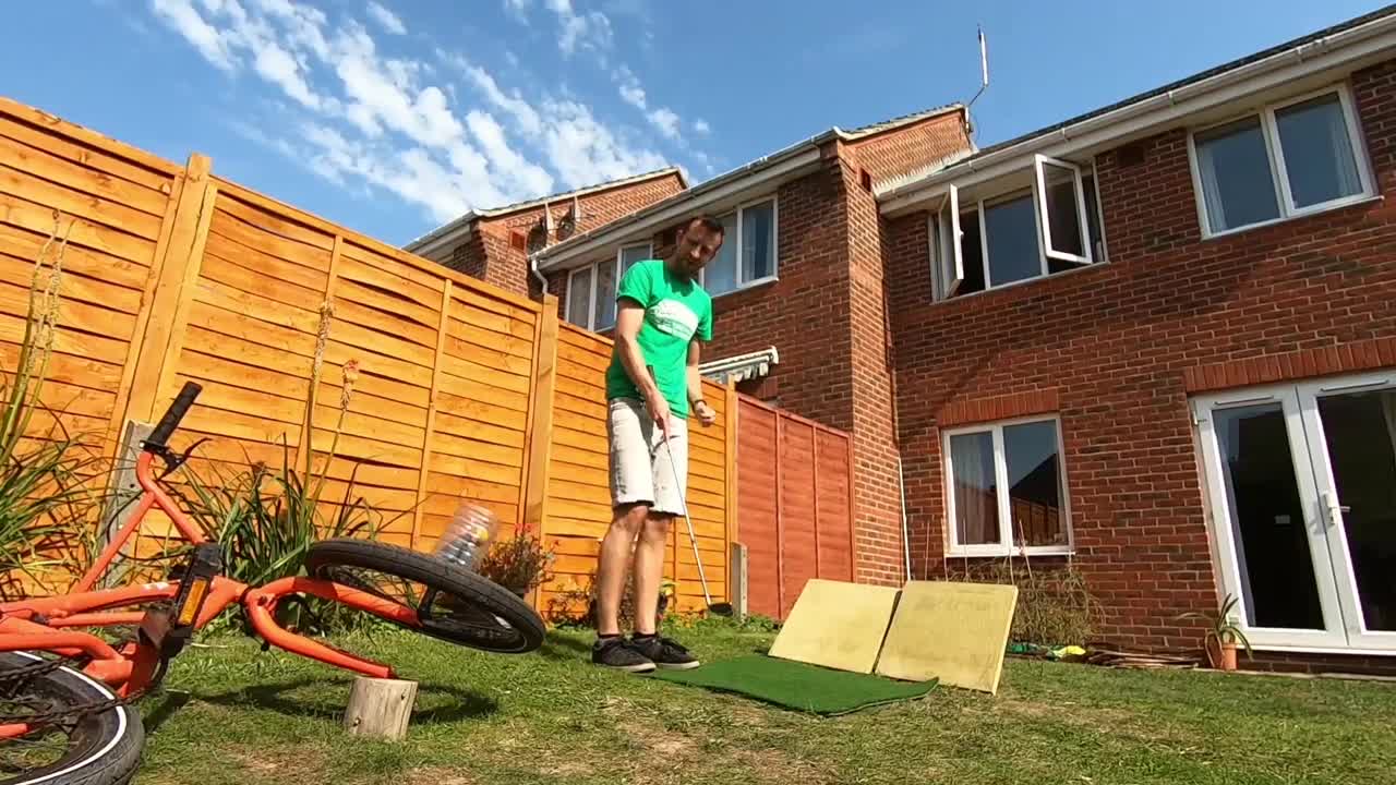 Young Man Performing Brilliant Trick Shot In His Backyard