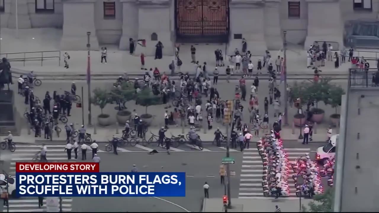 Pro-Palestinian protestors set fire to US flags in front of Philadelphia's City Hall