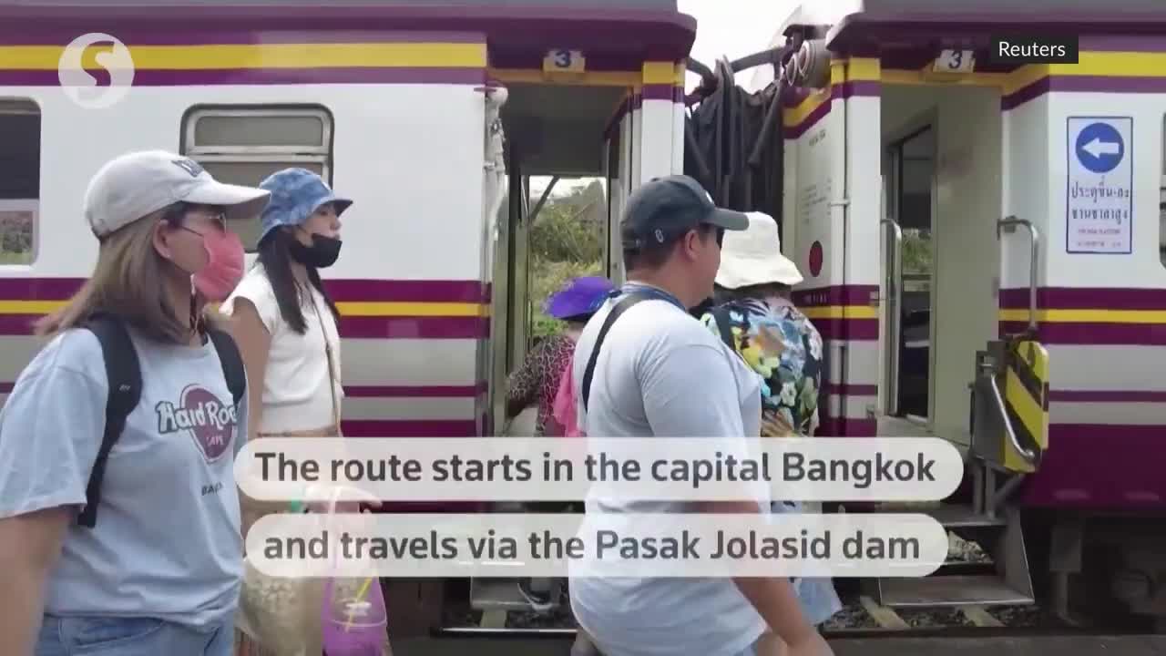 Thailand's 'floating train' a hit as dam waters rise