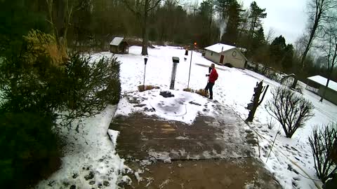 Man Slips And Falls While Walking Down Snow-Covered Steps