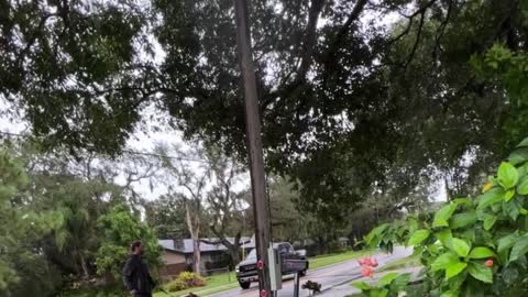 Neighbor rollerblading with dog as hurricane Ian moves South away from Tampa