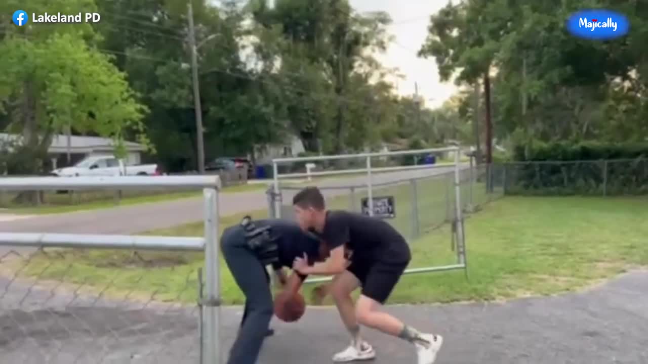 Female police officer schools local teen in game of one on one basketball