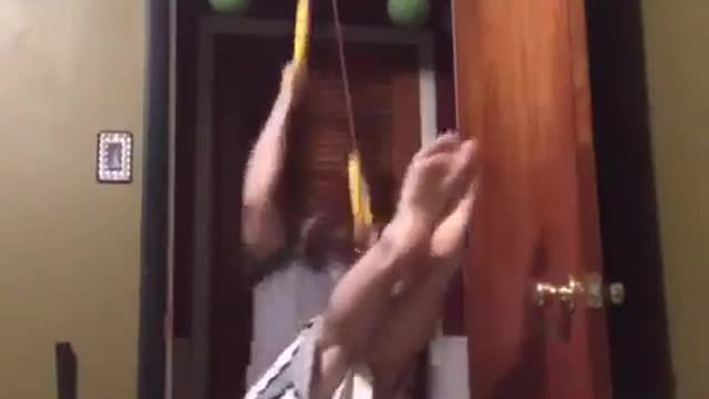 Guy Falls on Ground While Working Out With Rings Attached to Pulley