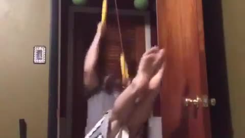 Guy Falls on Ground While Working Out With Rings Attached to Pulley