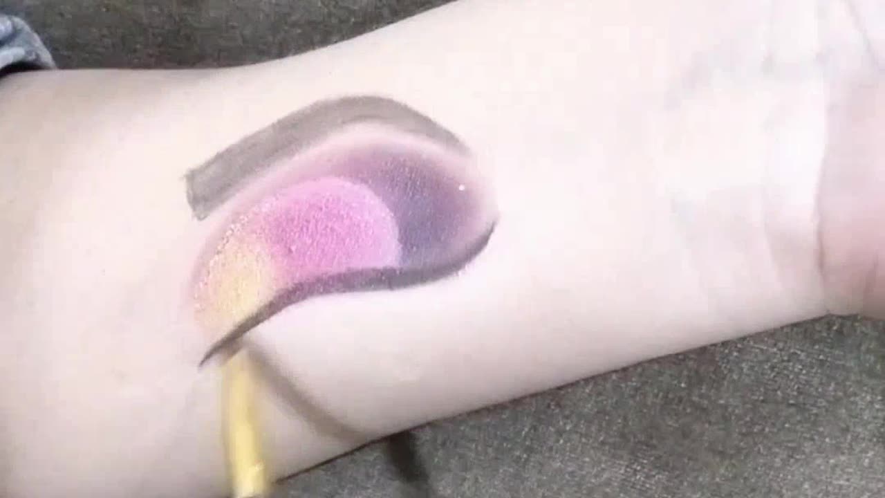 Eye makeup on arm