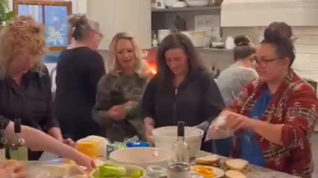 An army of patriotic women make sandwiches to hand to the truck drivers of the convoy for freedom in Canada