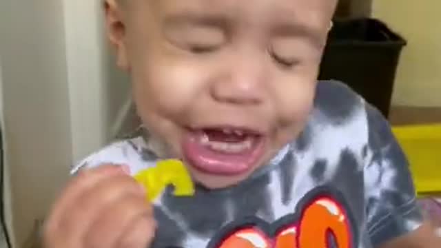 Toddler eats banana peppers