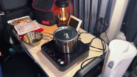 One person enjoys the self driving bread bed truck camping in the heavy snow