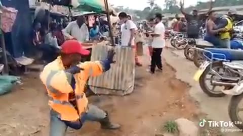 AFRICAN BIKER SHOWING THE CHINESE HOW GOOD IS HIS KUNFU