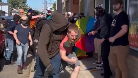 LGBTQ activist beats up teen whose father was bloodied by activists at an Indiana drag show for kids