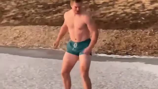 Guy Takes Dip in Frozen Lake