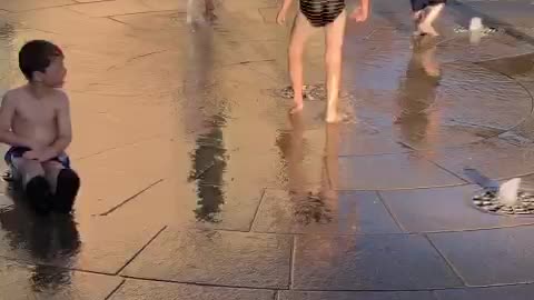 Kids playing with fountain