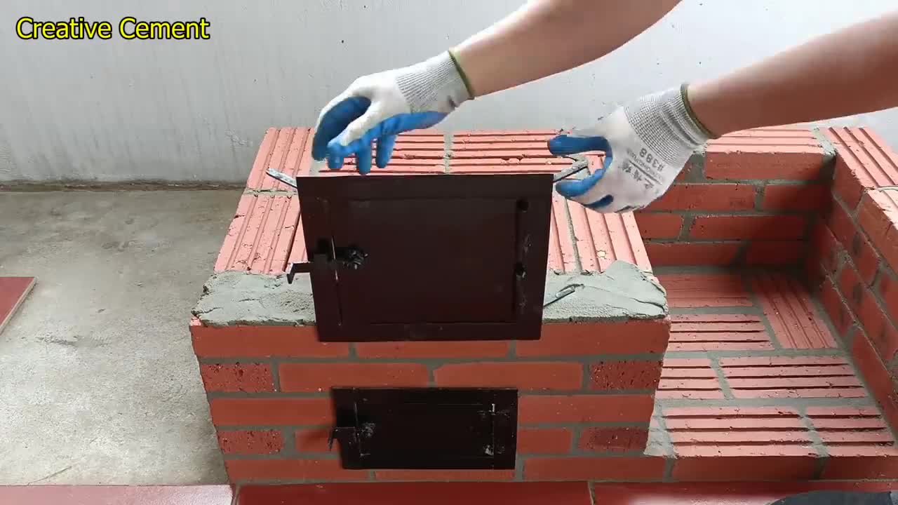 Outdoor wood stove from red brick and cement