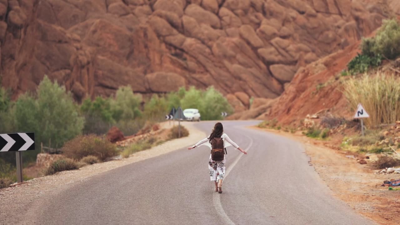 Woman Walking In The Middle Of The Road