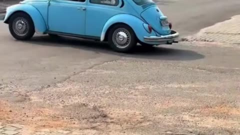 Fake police alarm prank on a VW Beetle! 🚔😂 The driver actually pulled over! #PrankGoneRight