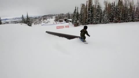 Snowboarding Kid Trips Trying to Jump Over an Obstacle