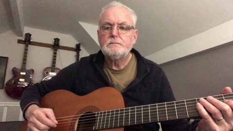 Playing a classical guitar with a reesha or oud pick.