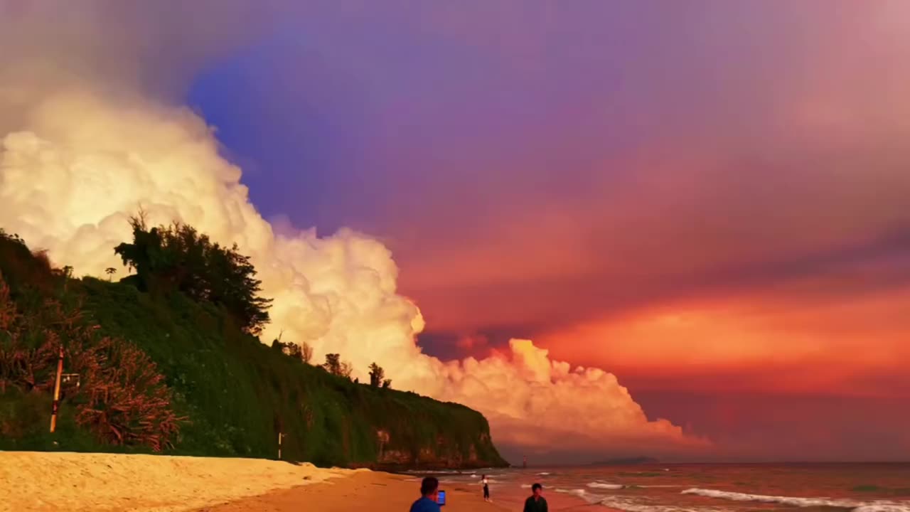 Watching the burning clouds by the sea