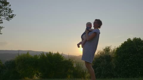 Young mother and her baby outside