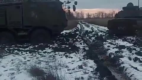 The 2S1 Gvozdika tracked self-propelled howitzer is attempting to pull out the CAESAR