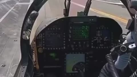 View from inside of an F-18 cockpit as it takes off from an aircraft carrier.