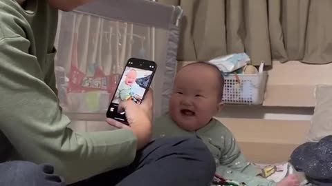 Kids laughing while watching at camera