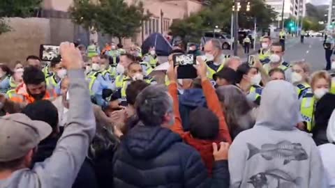 A white car approached police and protesters