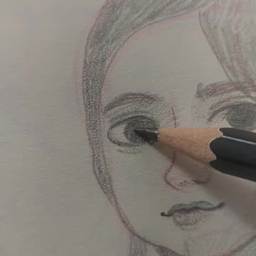 A simple pencil sketch of a girl's face.
