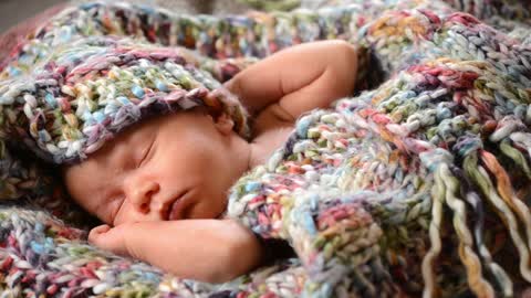 Newborn baby having a nap