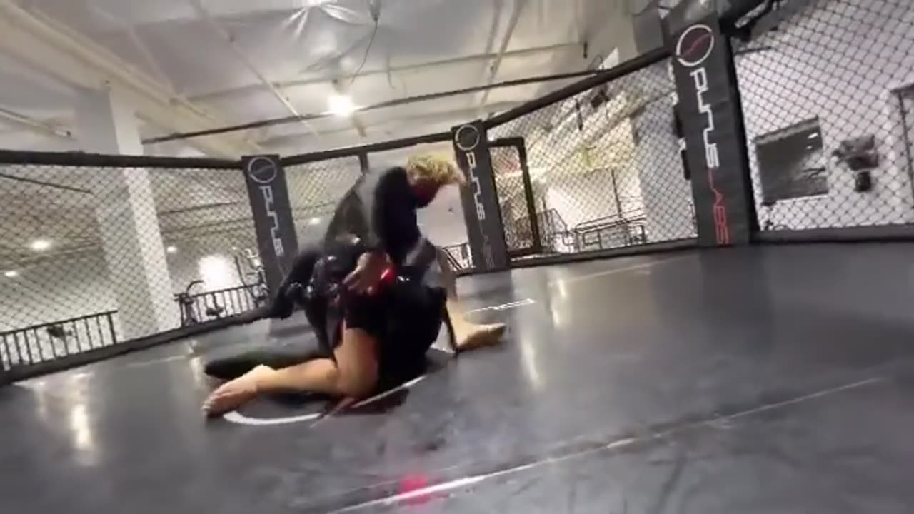 Urijah Faber grappling with a robot