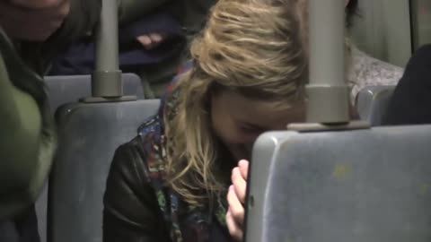 Man laughing on train