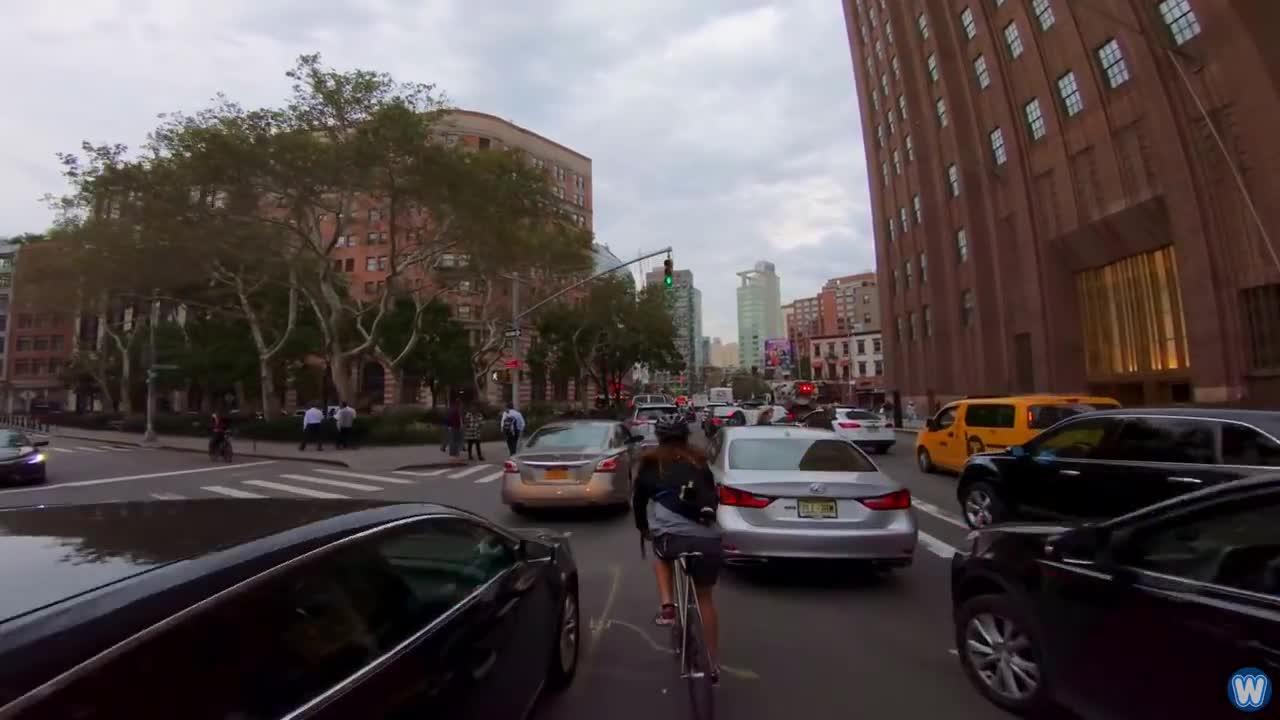 Bike Messenger Riding Fast and Fluid Through NYC Traffic