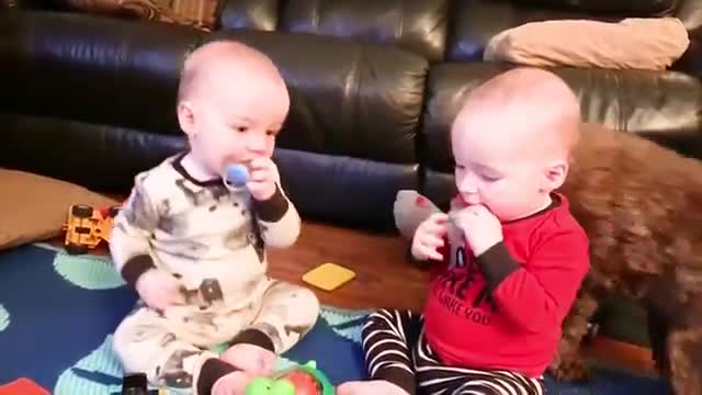 BabySiblings Playing and Laughing Together