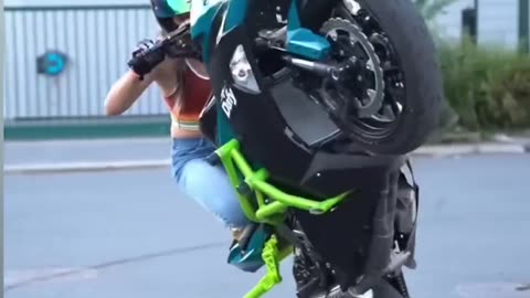 Girls bike stunt