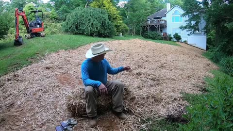 Kubota Excavator Pulling Stumps and Grading Yard