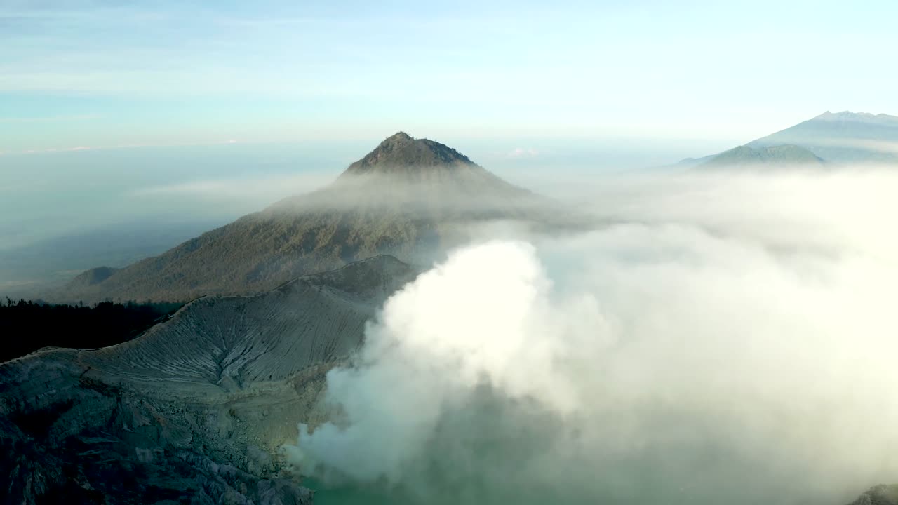 Volcano, steam and sky