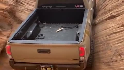 Truck climb up cliff