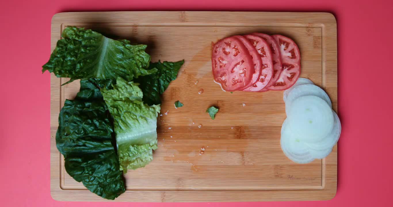 A Man Cutting Vegetables With A Knife