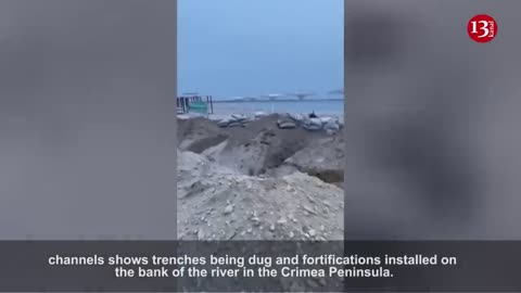 New footage from Crimea - Russians preparing to defend themselves by digging trenches on a sea coast